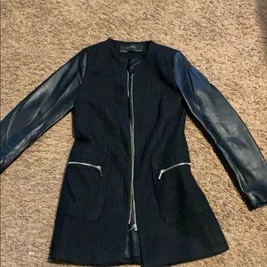 Black coat with fake leather sleeves.